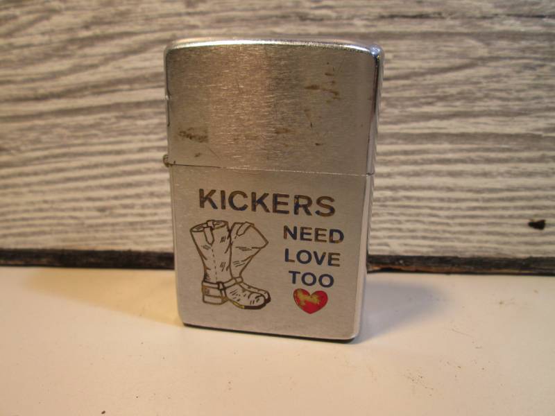 lot 44 image: Kickers Need Love Too Zippo Lighter...