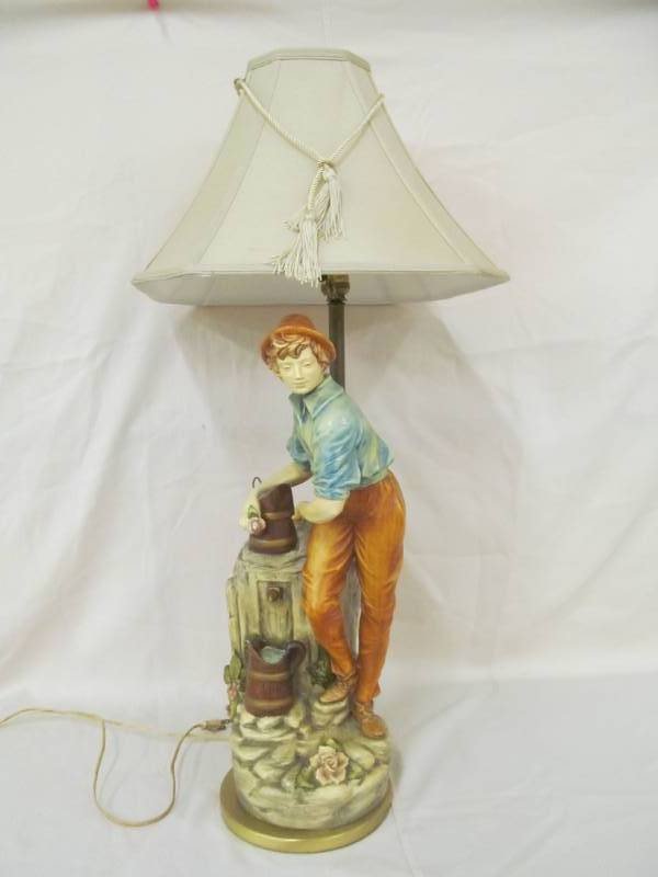 lot 18 image: Boy at well lamp