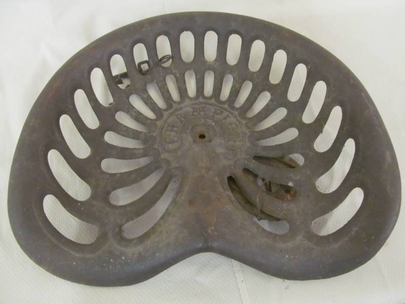 lot 38 image: vintage cast iron tractor seat