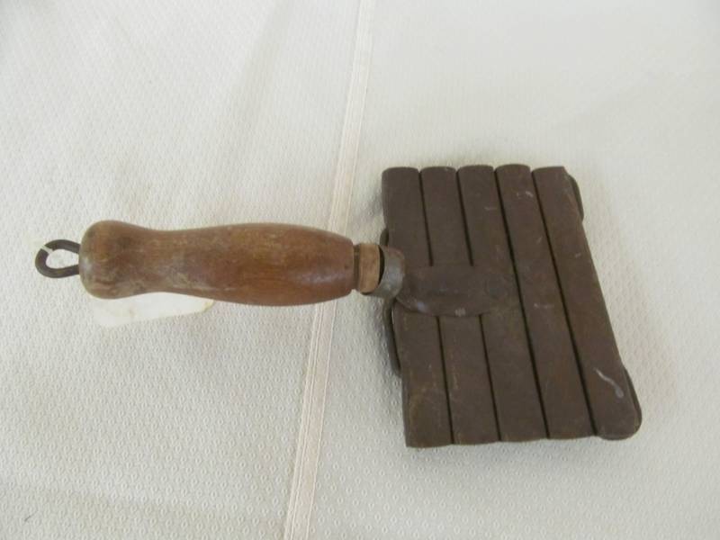 lot 68 image: Antique seed scraper