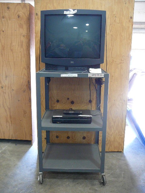 lot 102 image: Metal Media Cart With Wheels, RCA Home Theatre TV, & Sony VHS & DVD PlayerRecorder