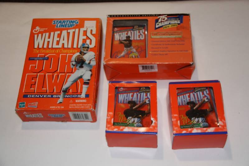 lot 57 image: Lot of 4 Wheaties Collectibles John Elway Tiger Woods Cal Ripken Jr