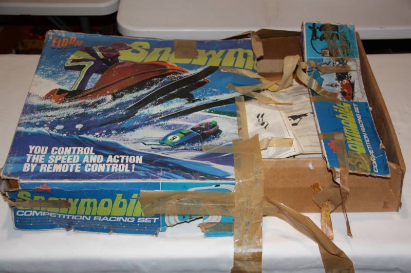 lot 119 image: Eldon Snowmobile Slot Racing Set