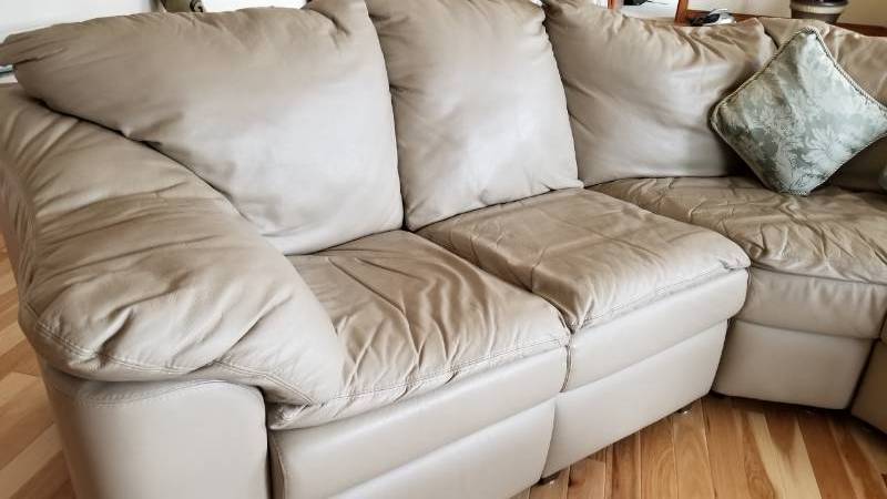 lot 20 image: Taupe Leather Sofa with Recliner and Pullout Bed