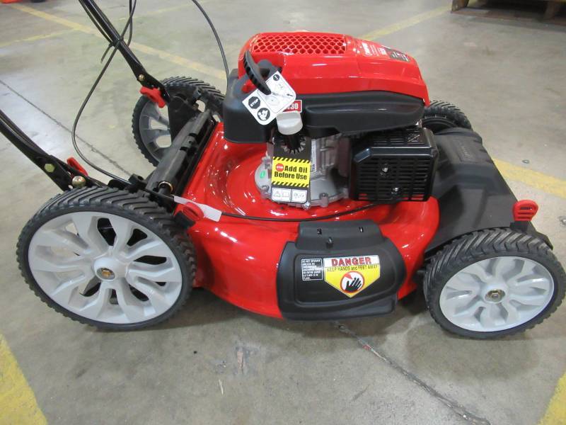lot 165 image: Troy-Bilt 21 in. 159 cc Gas Walk Behind Self Propelled Lawn Mower with Check Dont Change Oil, 3-in-1 TriAction Cutting System, TB230 - Bent Rear Wheel.