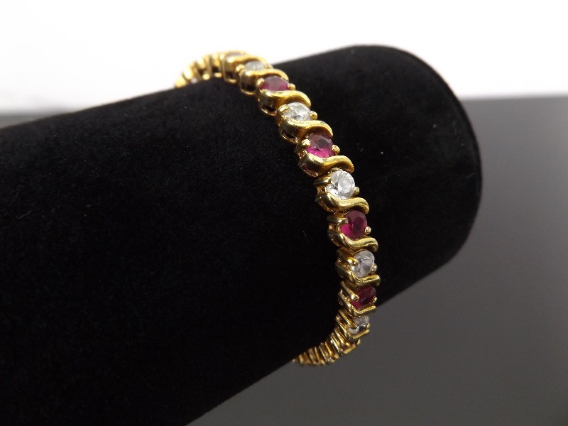 lot 29 image: .925 Sterling Silver Pink Sapphire Crystal Vermeil Tennis Bracelet