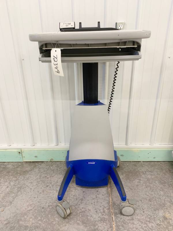 lot 28 image: WOW HOWARD MEDICAL HI CARE POWERED COMPUTER MOBILE&nbspWORKSTATION CART - PLUG INBATTERY POWERED UPDOWN MOTION SIT TO STAND WORK CENTER - NICE WORKING CONDITION MONITOR STAND ON BACK MISSING- GREAT FOR LAPTOP ETC