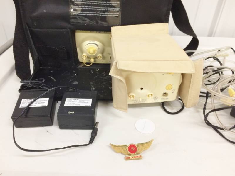 lot 14 image: Medela Pump in Style Original Dual Breastpump With Case - Comes with Sun Country Flight Wings Pin & All Other Items Shown In Picture