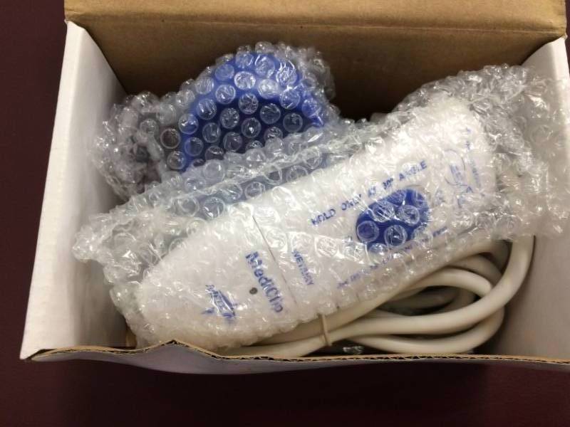 lot 45 image: NEW IN BOX MediClip Surgical Clipper with Charger and Base, White 