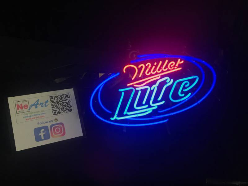lot 54 image: MIller Lite neon with blue hoops