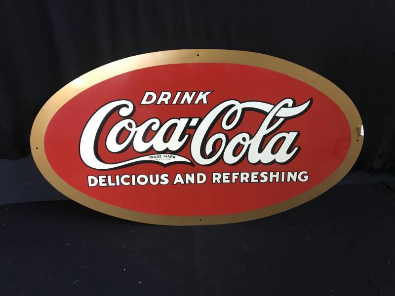lot 173 image: Coke Coca-Cola oval shaped painted tin
