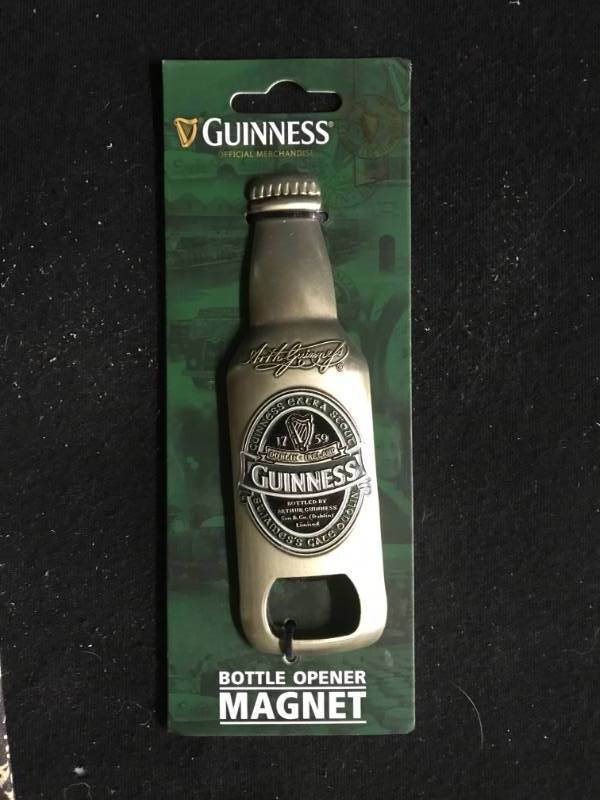 lot 178 image: Guinness towel and bottle opener with magnet
