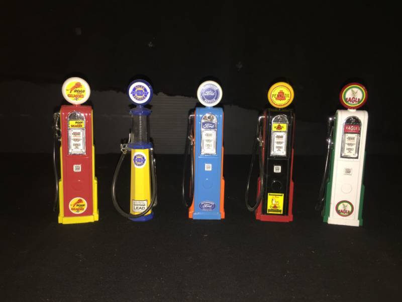 lot 211 image: Five mini-gas pumps and one metal bank