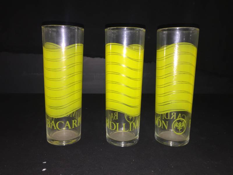 lot 214 image: Bacardi Limon glasses with graphic yellow waves