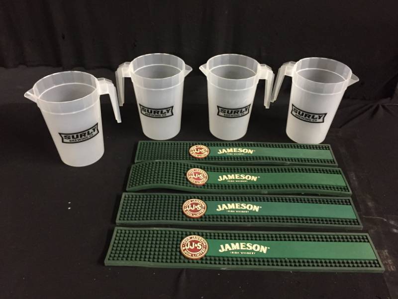 lot 228 image: Surly Beer pitchers and Jameson bar mats