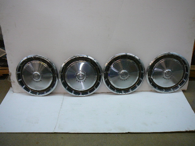 lot 8 image: Vintage 14 Ford Mustang Wheel Covers