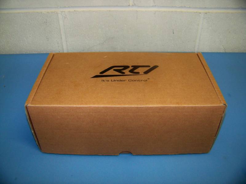 lot 69 image: RTI Corp, T2-C, Universal Remote Control  Controller with Dock - NEW in Original, Open Box
