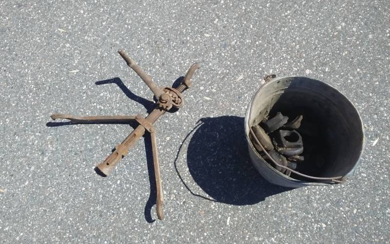 lot 22 image: Pail Of Old Wagon Nuts & Master Rim Tool