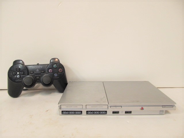 lot 124 image: Working PS2 PlayStation 2 Slim Video Game System