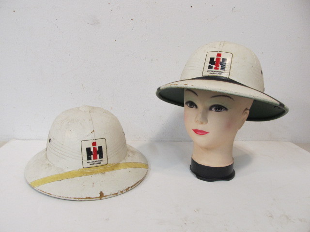 lot 109 image: Pair of Orig vintage INTERNATIONAL HARVESTER Pith Helmets