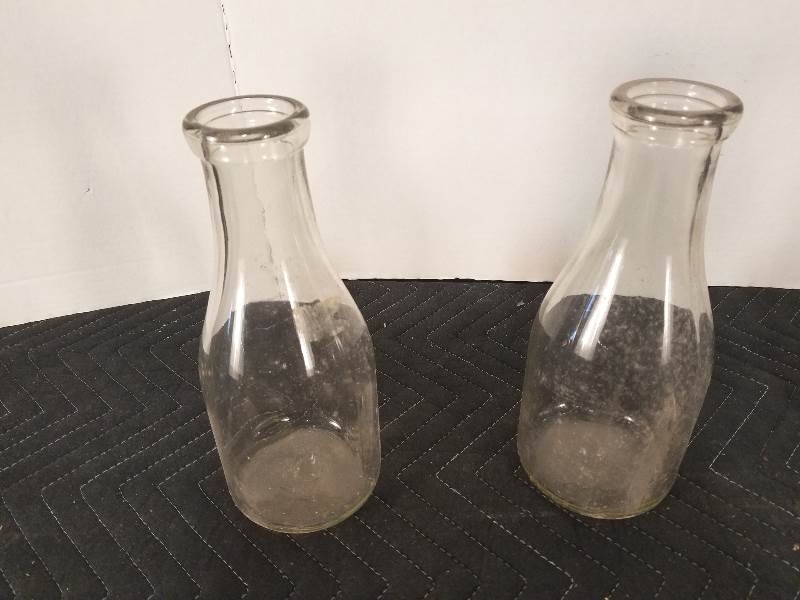 lot 63 image: Old Glass Milk Bottles