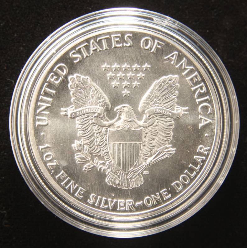 lot 27 image: 1987 AMERICAN SILVER EAGLE 1 TROY OZ. .999 FINE SILVER IN AIRTITE