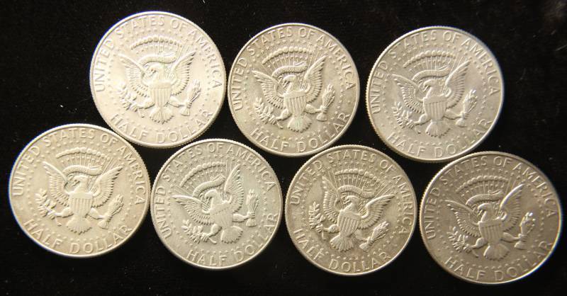 lot 54 image: GROUP OF 7 KENNEDY 40% SILVER HALF DOLLARS