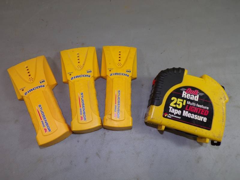 lot 25 image: 3 Stud finders and lighted Tape measure