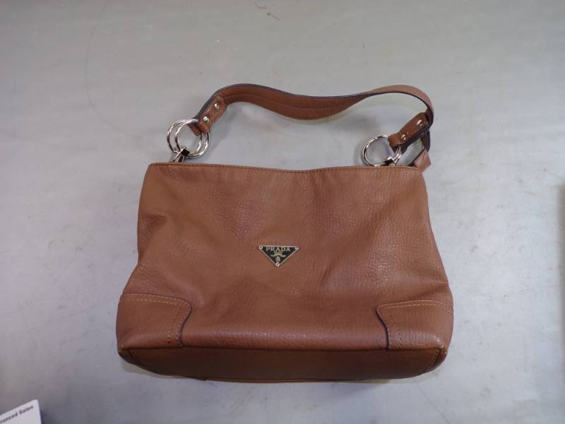 lot 69 image: Brown leather high end purse