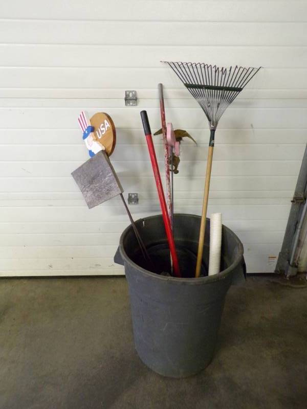 lot 76 image: Garden Ornaments, rake, extension handles, garbage can, etc