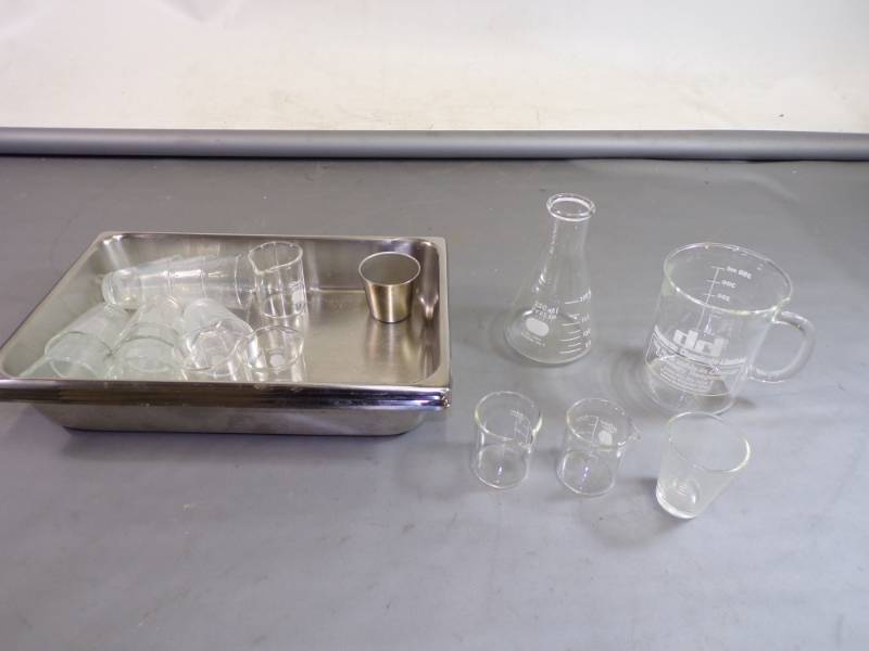 lot 105 image: Set of 4 stainless steel trays, beakers , etc