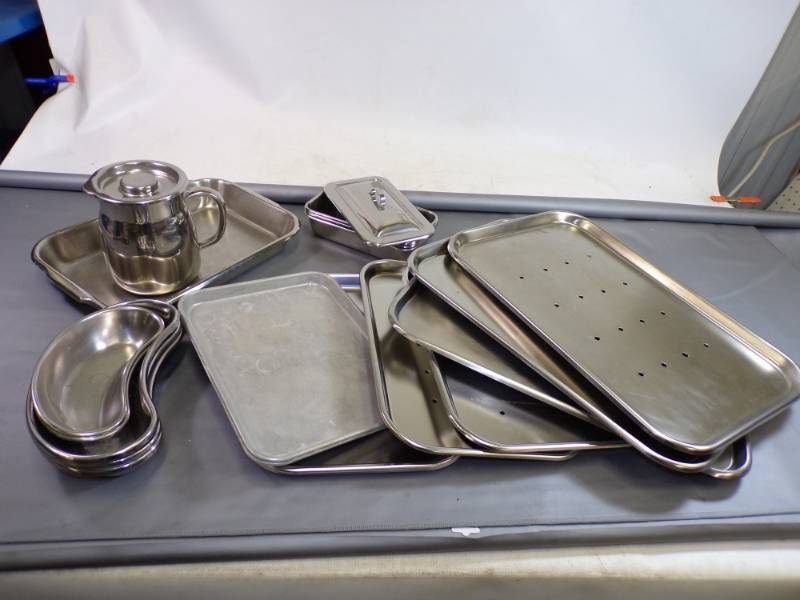 lot 106 image: Large lot of stainless steel trays and pitcher