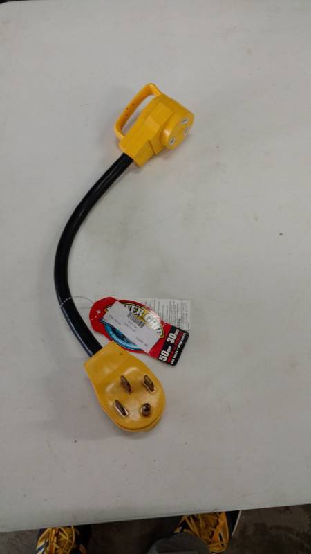lot 11 image: Two 50 amp male to 30 amp female plugs