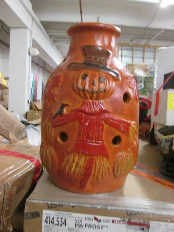 lot 200 image: Terra Cotta Scarecrow Urn...