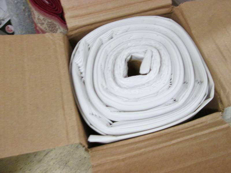 lot 205 image: Roll of Plastic Sheeting...