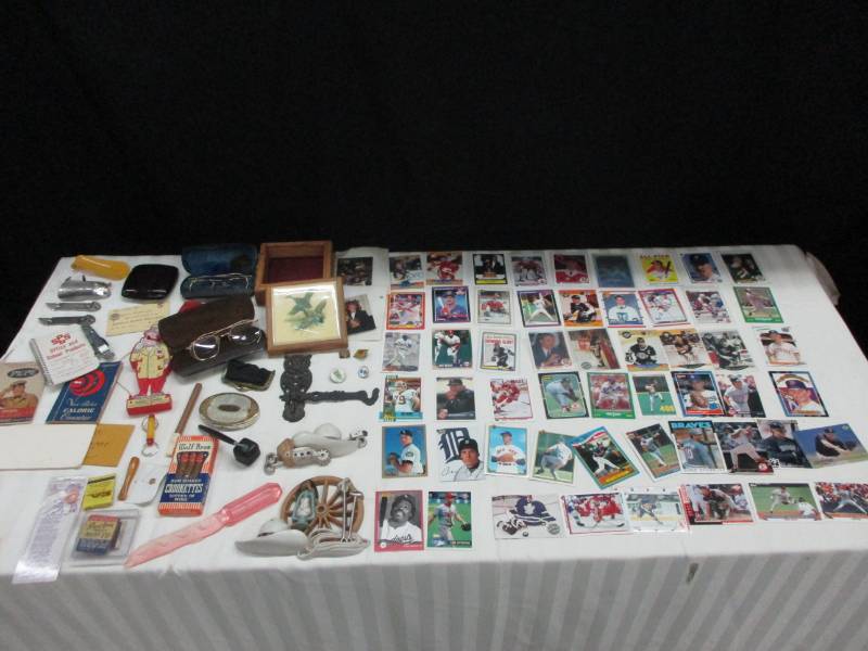 lot 7 image: Nice Collectibles, GrainBelt, Baseball Cards, Antique Old Glasses, Owl Hook, Old Money bag, Letter opener, Advertising Pieces, Collector advertisinf Tables, Pepe Book