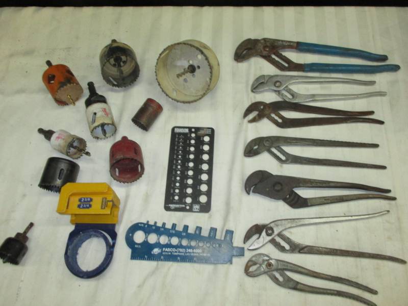 lot 14 image: Assortment of Hole Saws a channel Lock and lots of Pliers