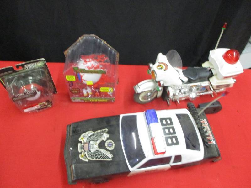lot 111 image: Old Cop Car and Bike, not sure they work, no remotes and other toys