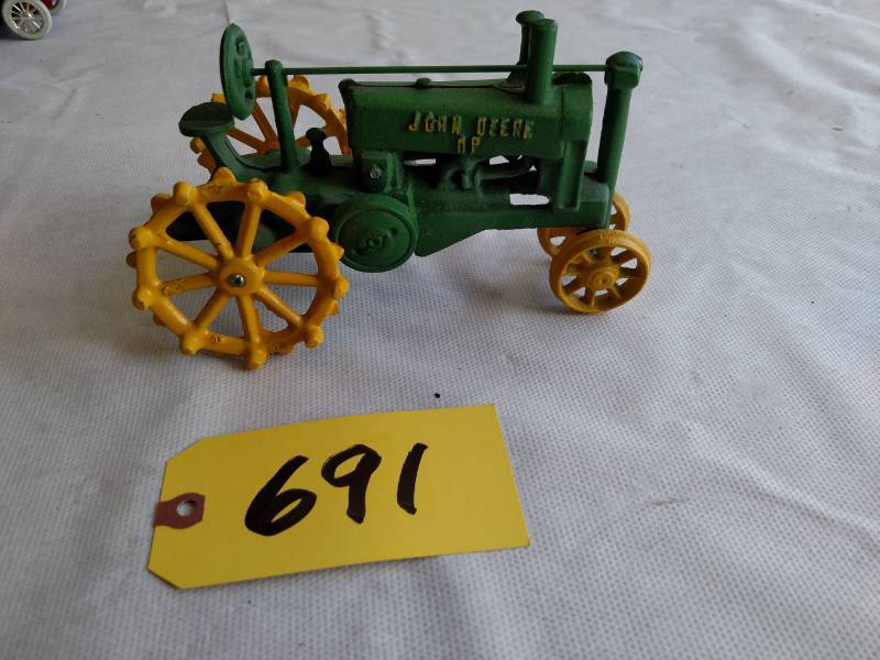 lot 691 image: John Deere OP Cast Iron Tractor...