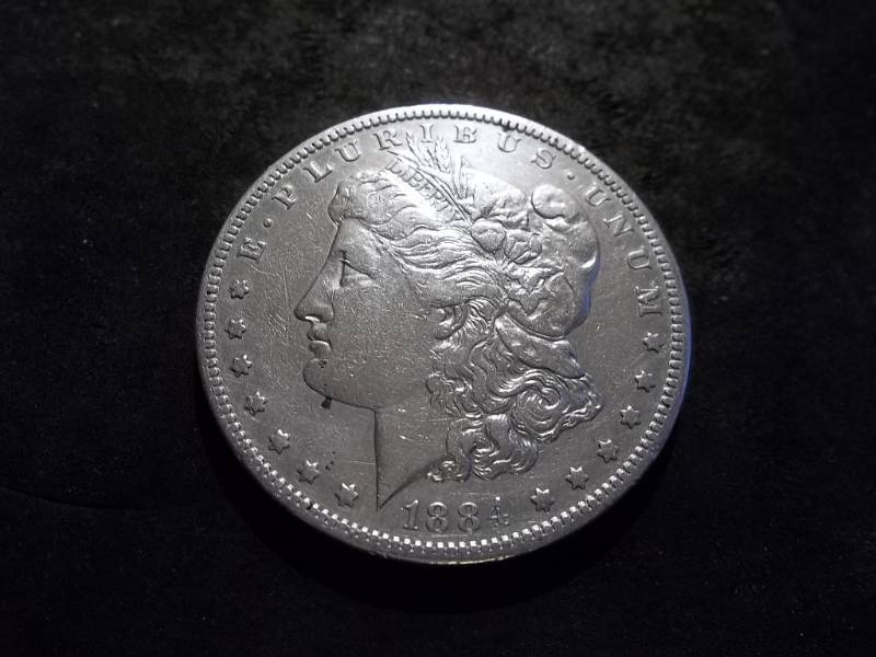 lot 11 image: 1884 S Morgan Silver Dollar