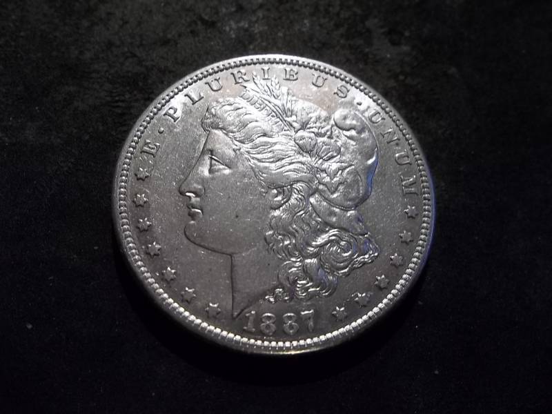 lot 18 image: 1887 S Morgan Silver Dollar