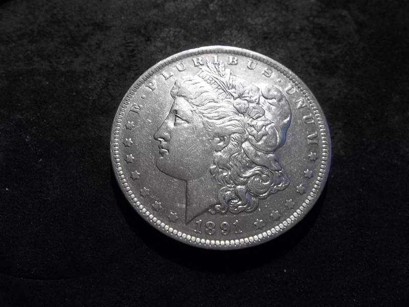 lot 24 image: 1891 O Morgan Silver Dollar