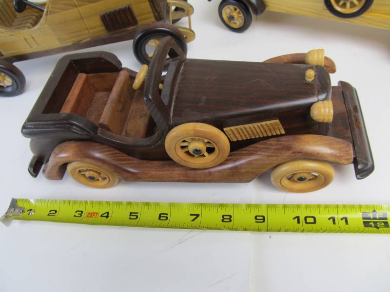 lot 87 image: Group of 12 Solid Wood Antique Style Cars