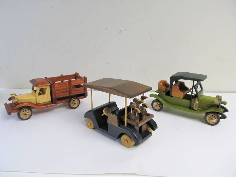 lot 88 image: Group of 12 Solid Wood Antique Style Cars