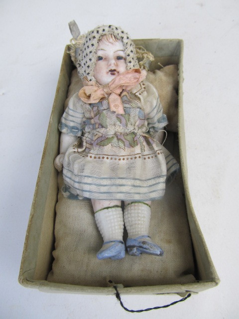 lot 153 image: Antique 1920s Jointed Bisque Doll wOriginal Outfit & Bed