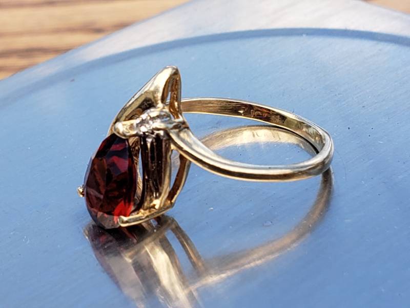 lot 68 image: Natural Garnet and Diamond Estate Ring in 10k Yellow Gold