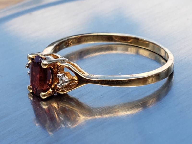 lot 70 image: Natural Garnet and Diamond Estate Ring in 10k Yellow Gold