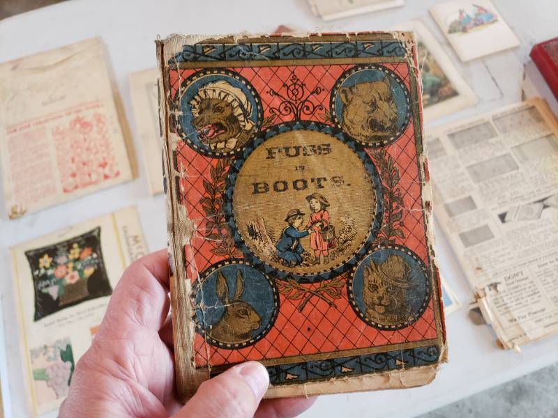 lot 111 image: 1877 Puss in Boots Book, Antique McCall TransferPattern, Tennyson Book, Etc.
