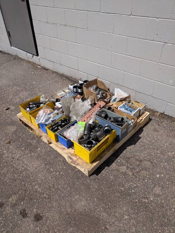 lot 18 image: Plumbing Pallet Lot - Black Pipe Fittings, Hardware, Hangers & More