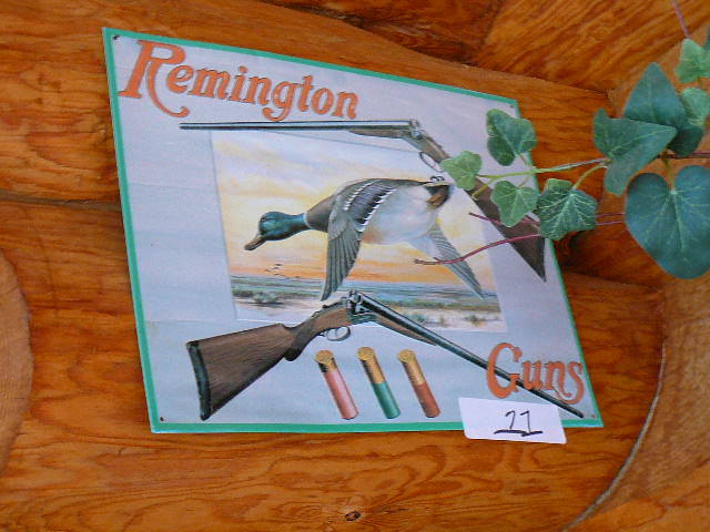 lot 11 image: Remington Gun metal sign Wooden Heart
